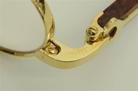 Hello. Wanted to know how much this cartier 135b gold and wood 